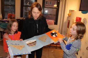 Abby looking at her daughter's finished book