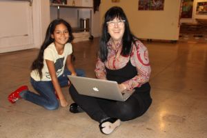 Layla & Cyndie looking at pics of Layla when she was 1 years old at Hi Art!