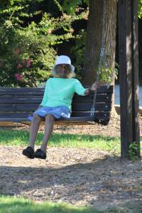 Grandma Sewell taking a break on the swing
