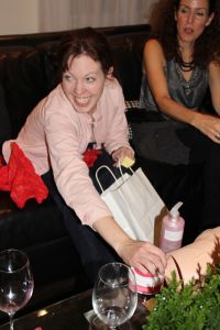 Jennifer opening a Secret Santa Present 