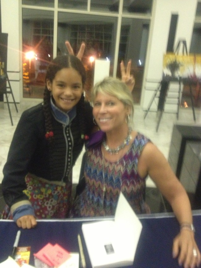 Alison & Layla giving each other "bunny ears"