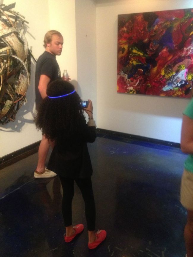 Layla checking out the art