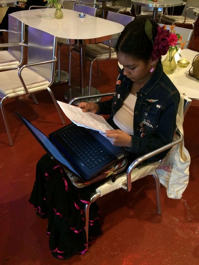 Layla getting homework done before the performance
